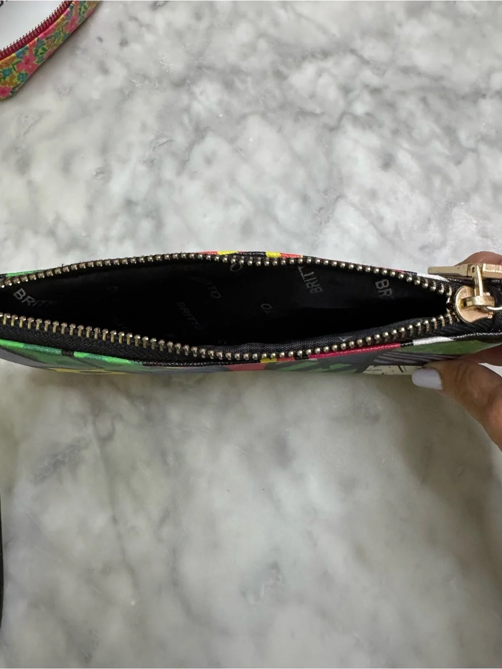 Brito Romero wristlet EUC